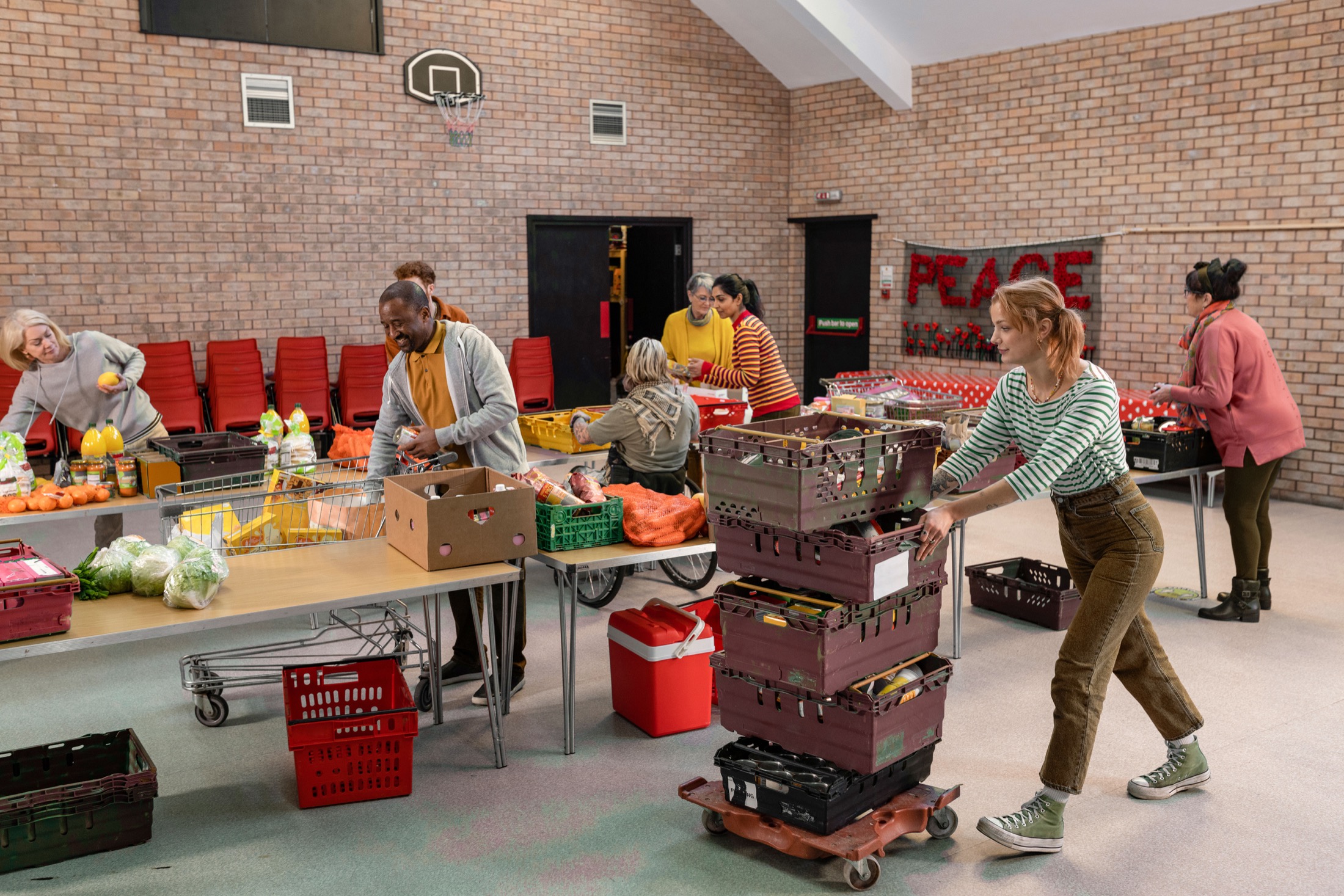 Volunteers sorting food at a community hall